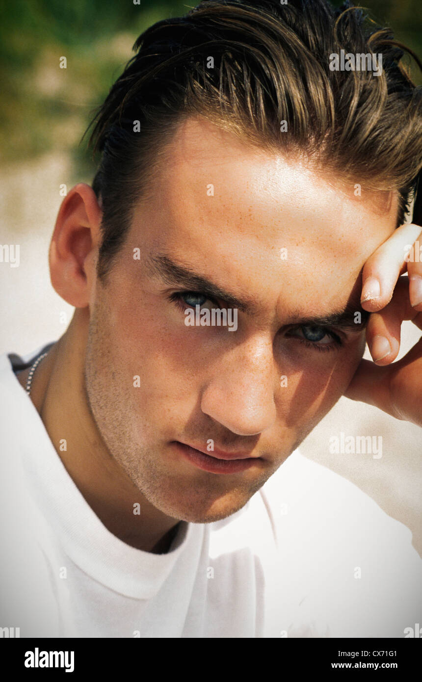 Young good looking teenage male at beach Stock Photo - Alamy