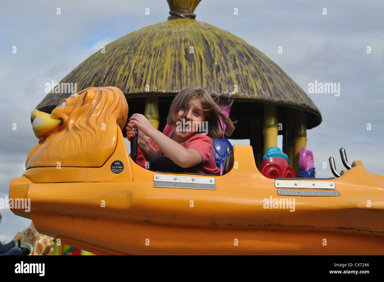 A Joyful Child Enjoying A Ride Stock Photo - Alamy
