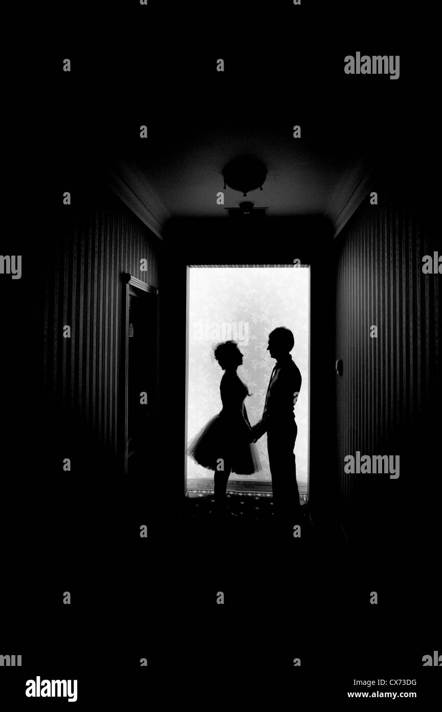 Silhouette couple holding hands Black and White Stock Photos & Images ...