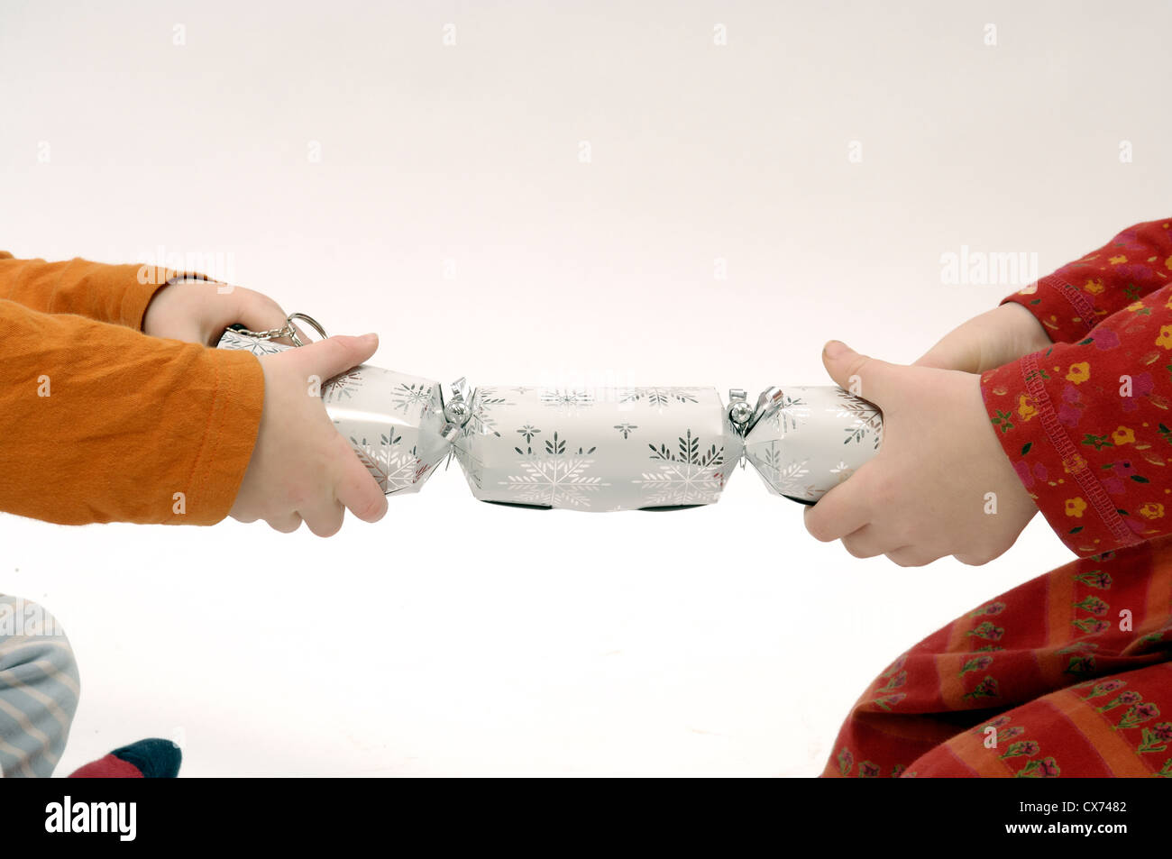 Girl and boy pulling a cracker hi-res stock photography and images - Alamy