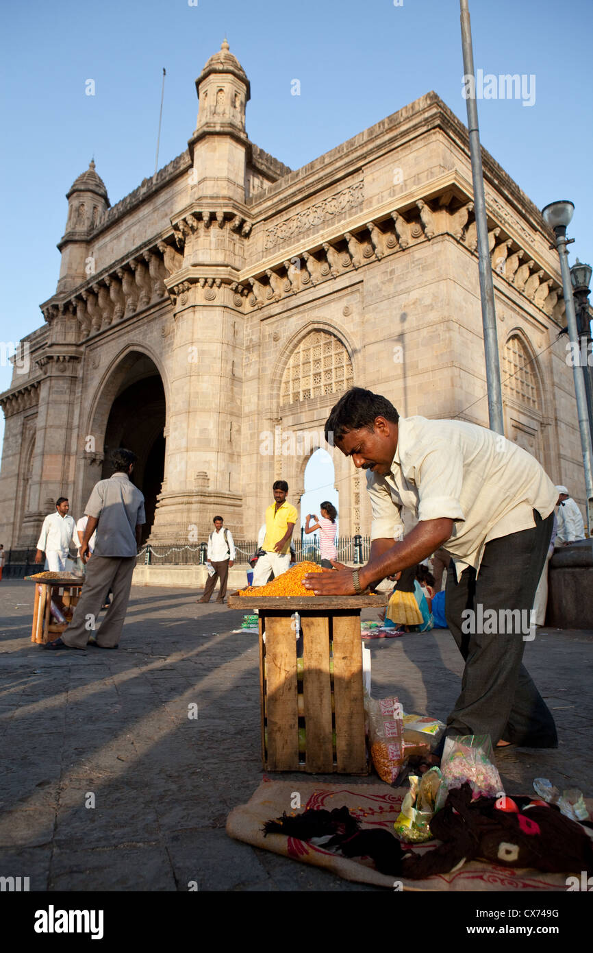 Street vendor in front of the Gateway of India in Colaba, Mumbai Stock Photo