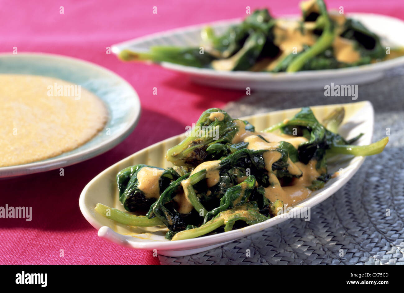 Spinach with indian curry - yogurt sauce Stock Photo