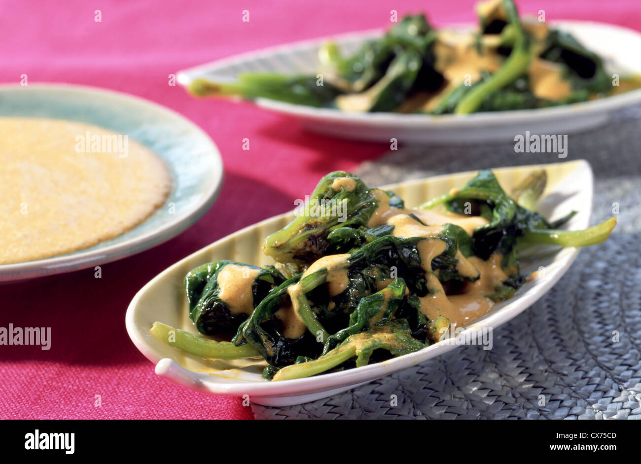 Spinach with indian curry yogurt sauce Stock Photo Alamy