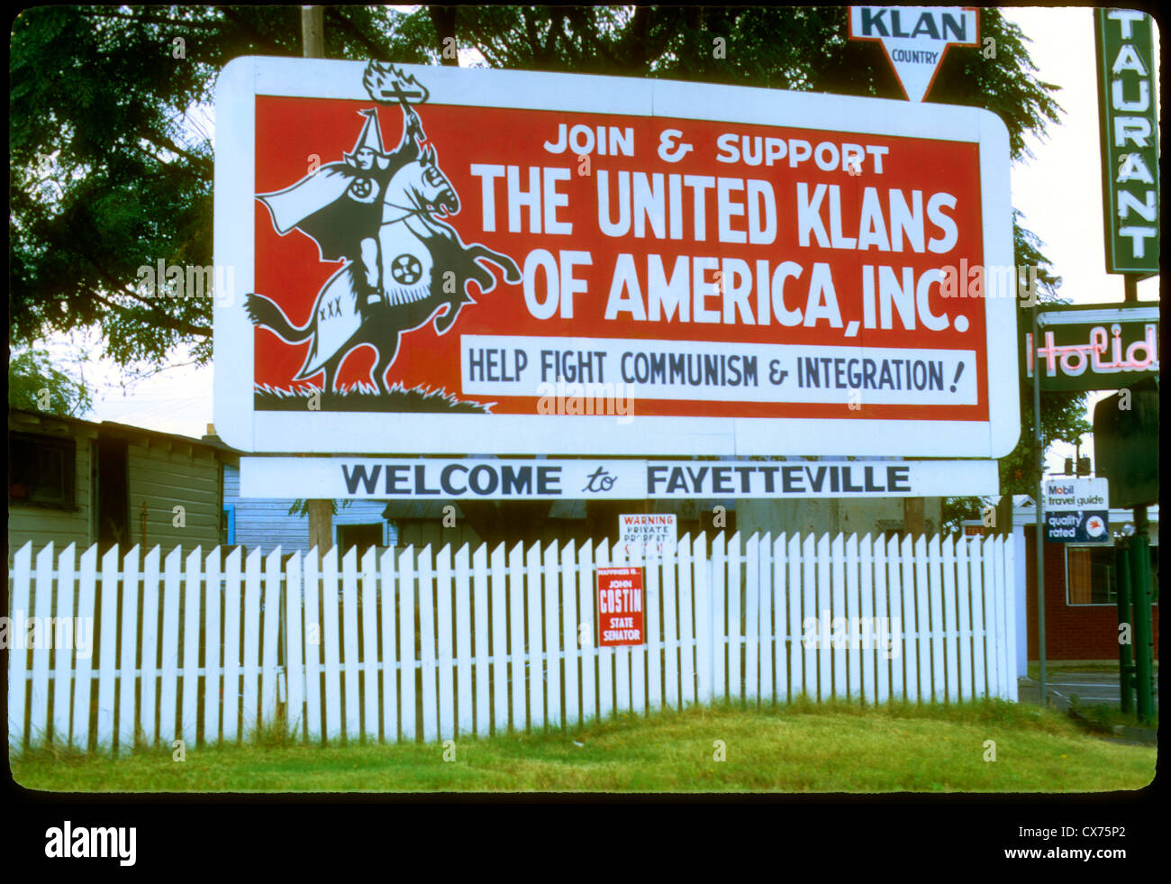 A billboard in Fayetteville, North Caroline promotes membership in the KKK during the early 1960s. Ku Klux Klan sign Fayetteville North Carolina racism racist 1960s American South right wing politics billboard sign KKK Stock Photo