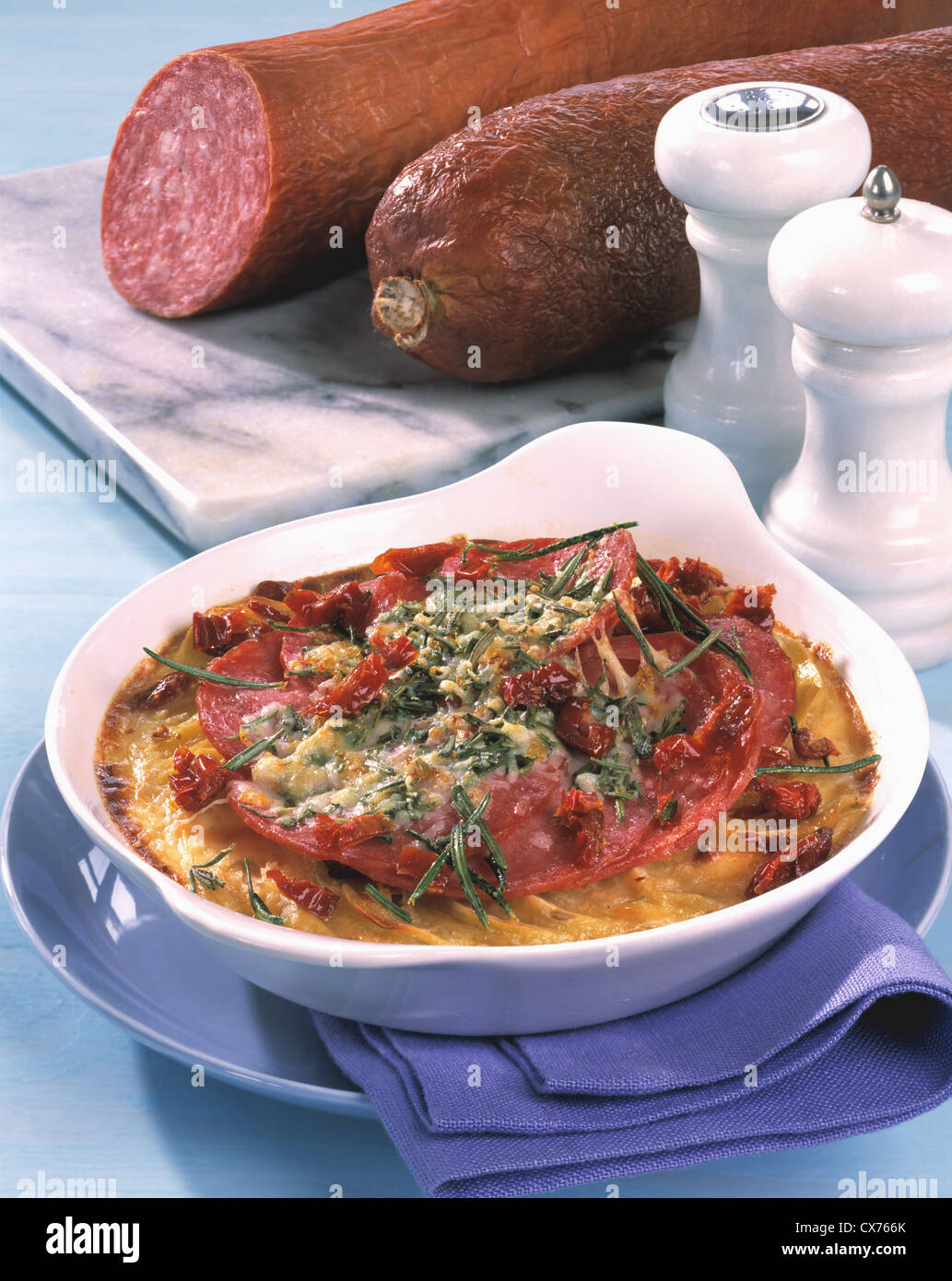 Potato herb - casserole with sausage au gratin Stock Photo