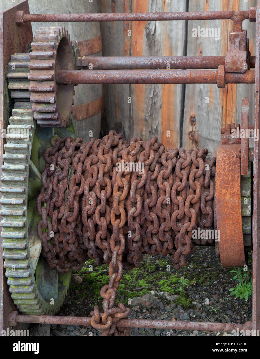 Rusting cogwheels and chain lifting gear. Stock Photo