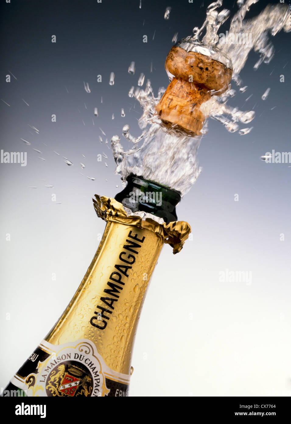 CHAMPAGNE BOTTLE WITH CORK POPPING Stock Photo - Alamy