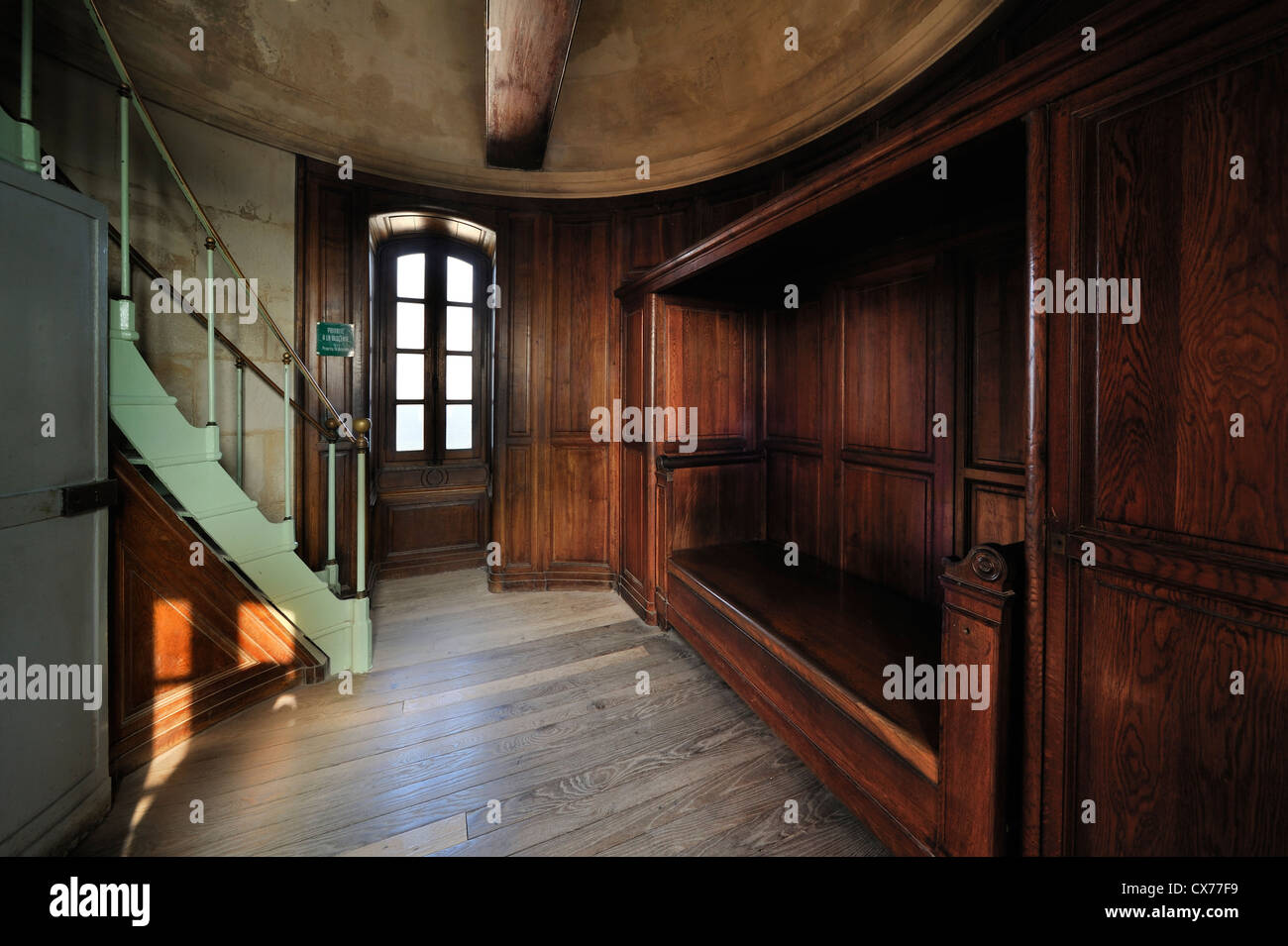 Wooden bed in bedroom inside the lighthouse Phare des Baleines on the ...
