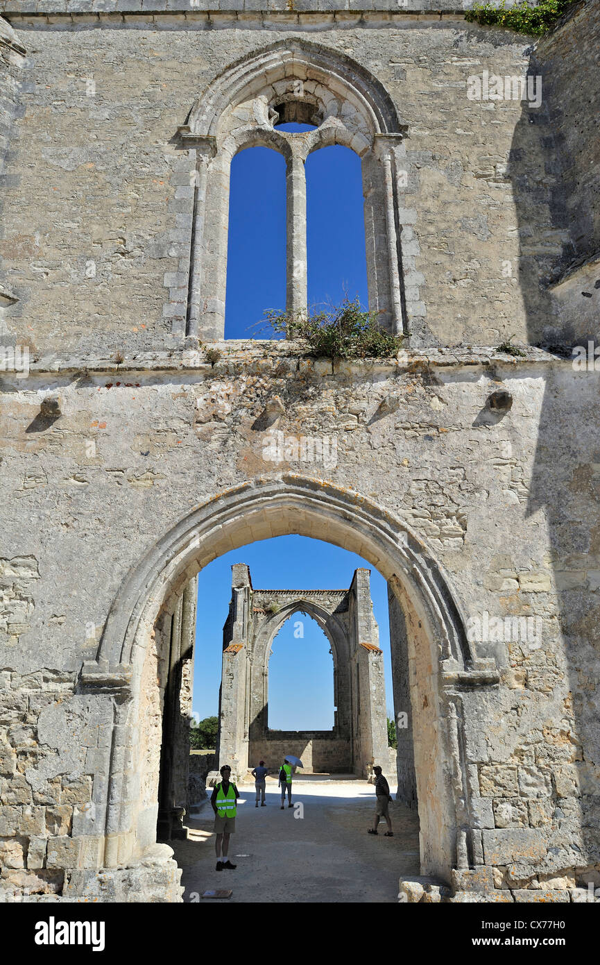 Tourists visiting the ruins of the abbey Notre-Dame-de-Ré / des Châteliers on the island Ile de Ré, Charente-Maritime, France Stock Photo