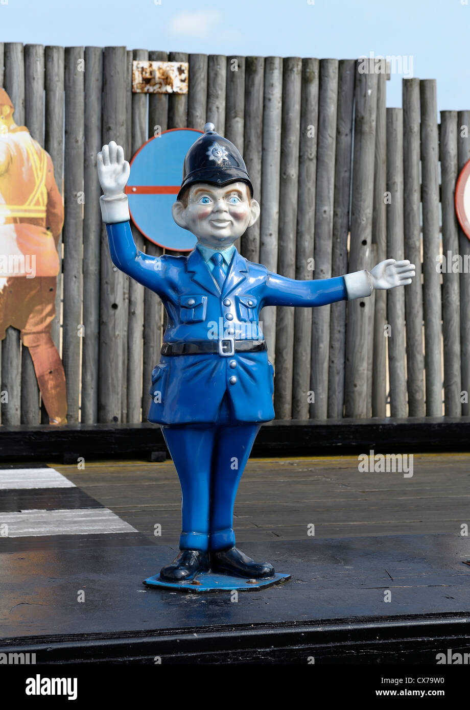 cartoon policeman on traffic duty on a fairground ride great yarmouth norfolk england uk Stock Photo