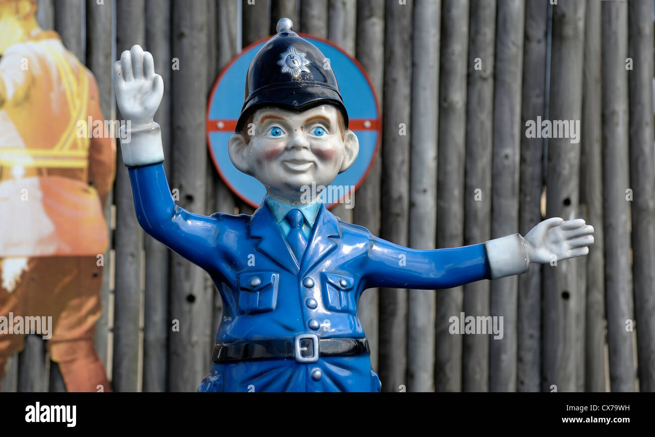 cartoon policeman on traffic duty on a fairground ride great yarmouth norfolk england uk Stock Photo