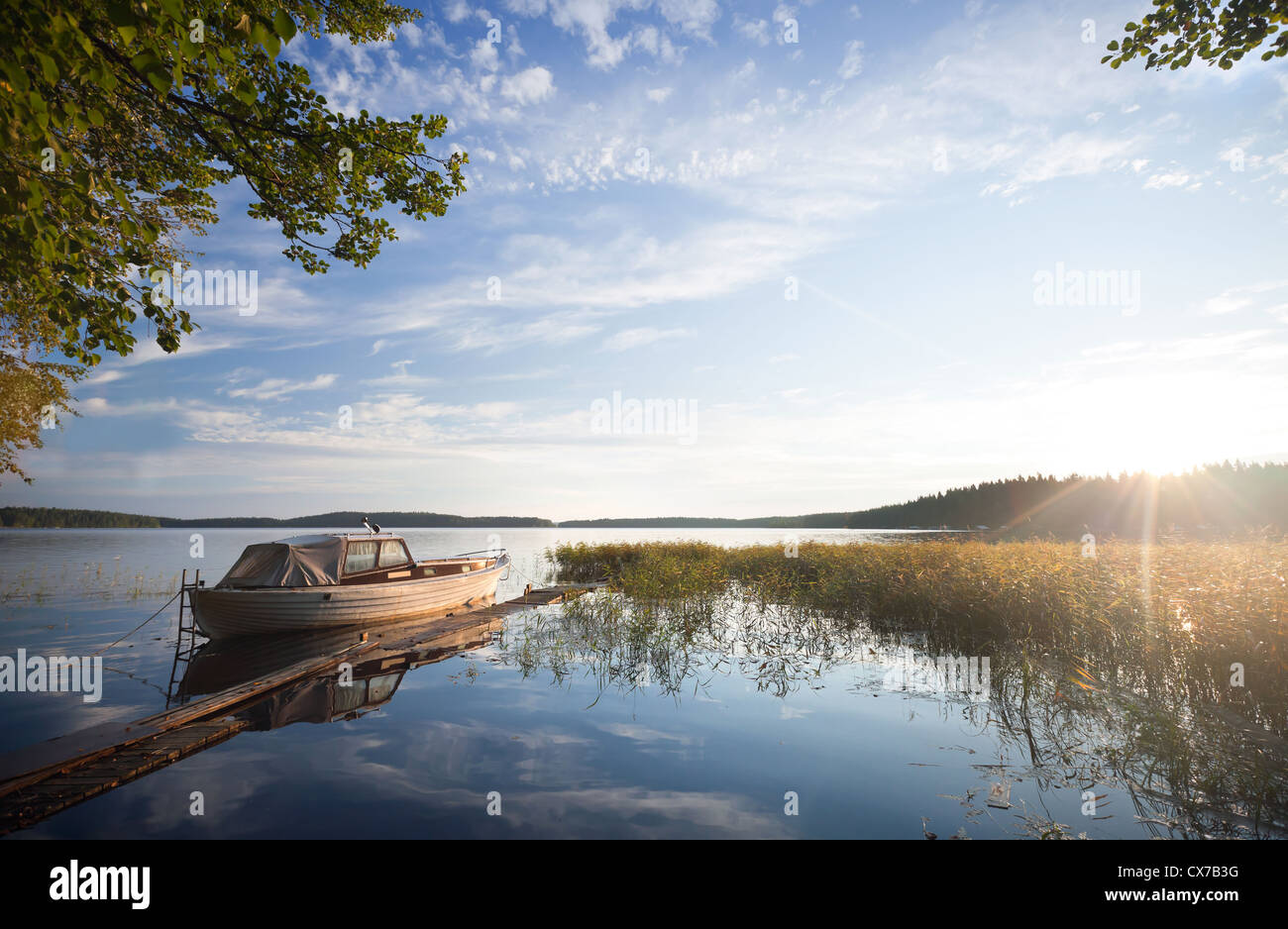 Small fishing boat moored on Saimaa lake in Imatra town, Finland Stock Photo