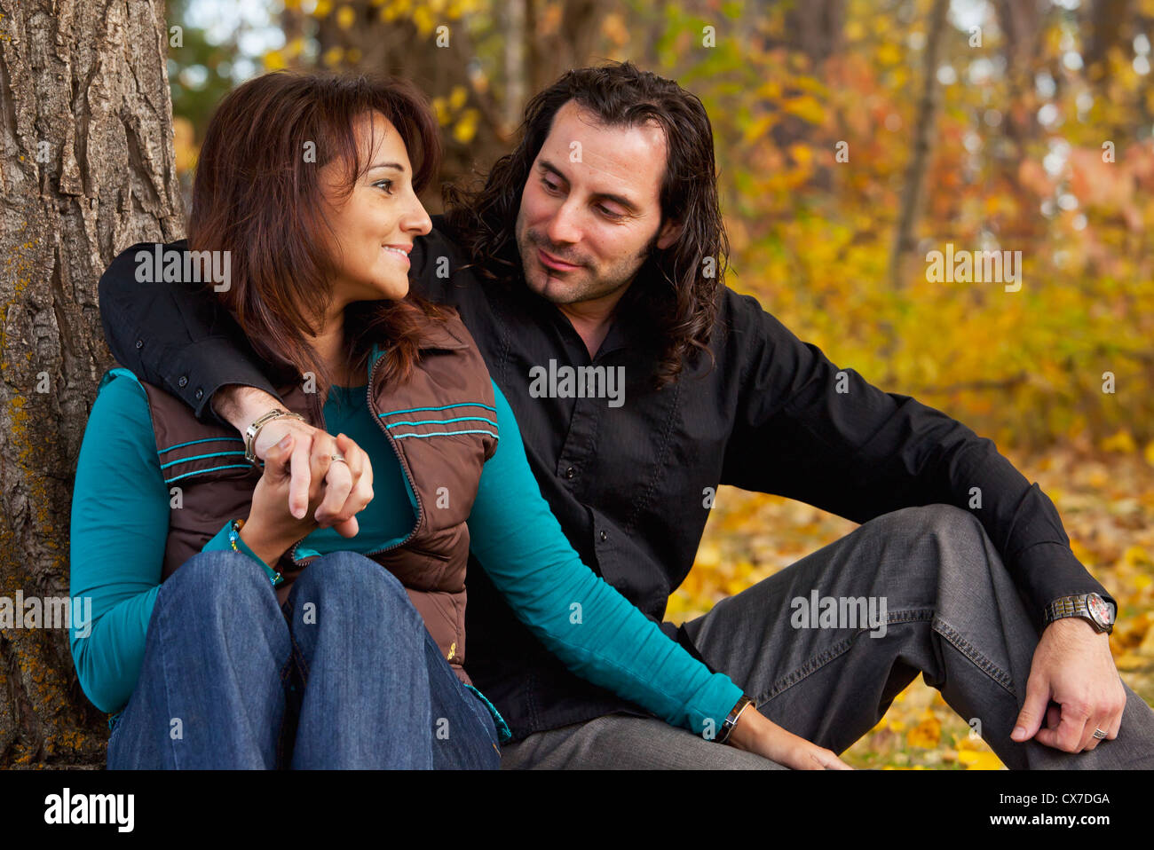 Group people sitting under tree hi-res stock photography and images - Alamy