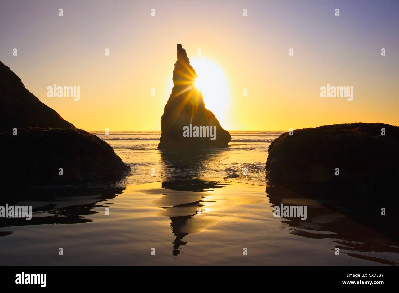 Rock Formations At Low Tide On Bandon Beach At Sunset; Oregon, United States Of America Stock Photo