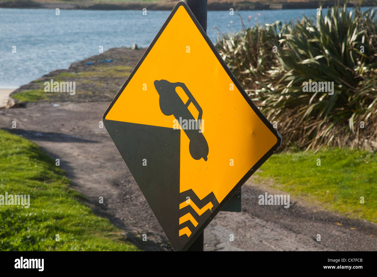 A Sign On The Road Indicating An Abrupt Edge At Derrynane Harbour; County Kerry, Ireland Stock Photo