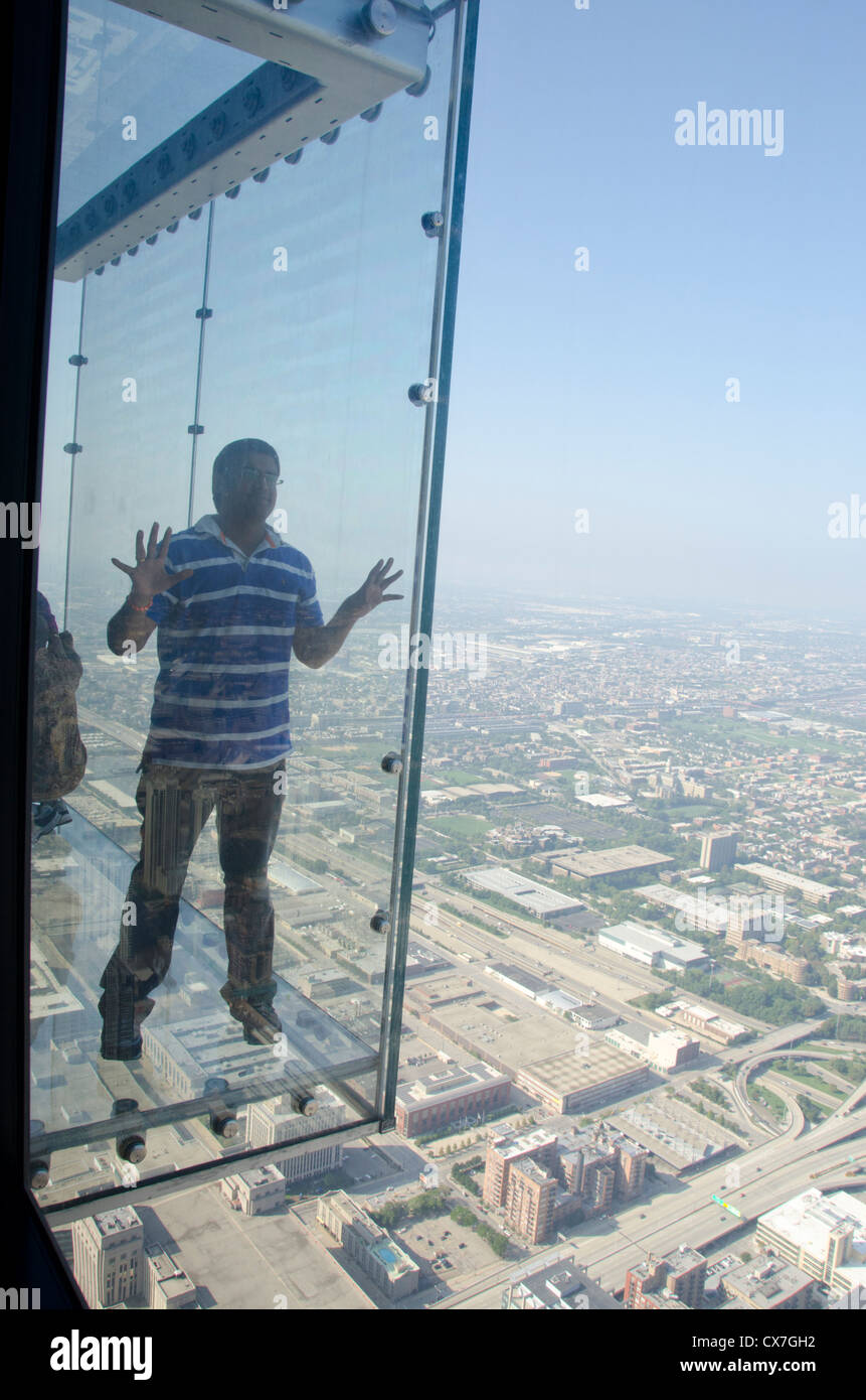 Illinois, Chicago, Willis Tower (aka Sears Tower). Tourists out on the 'Ledge' on Sky Deck Chicago. Stock Photo