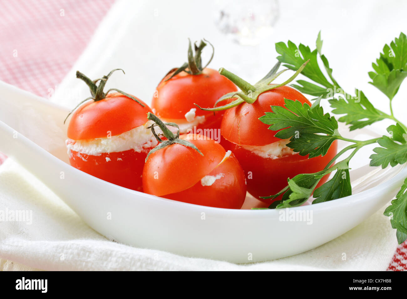 appetizer of stuffed tomatoes (soft cheese and parsley) Stock Photo