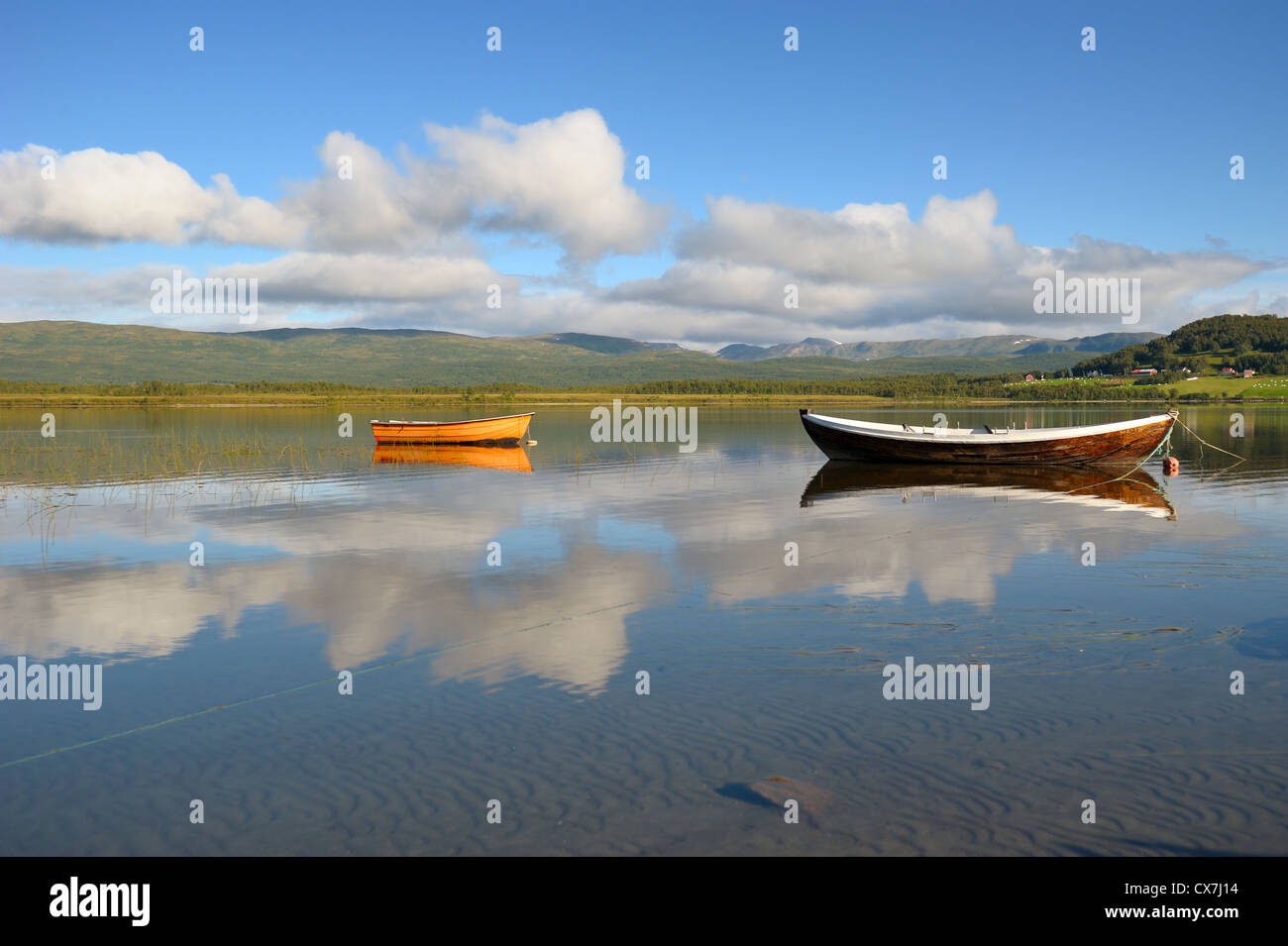 Wooden boats on the mountain lake Stock Photo - Alamy