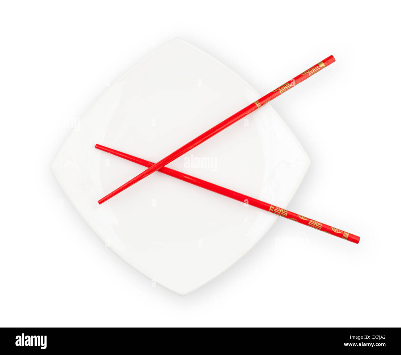 White plate with red chopsticks isolated with clipping path included Stock Photo