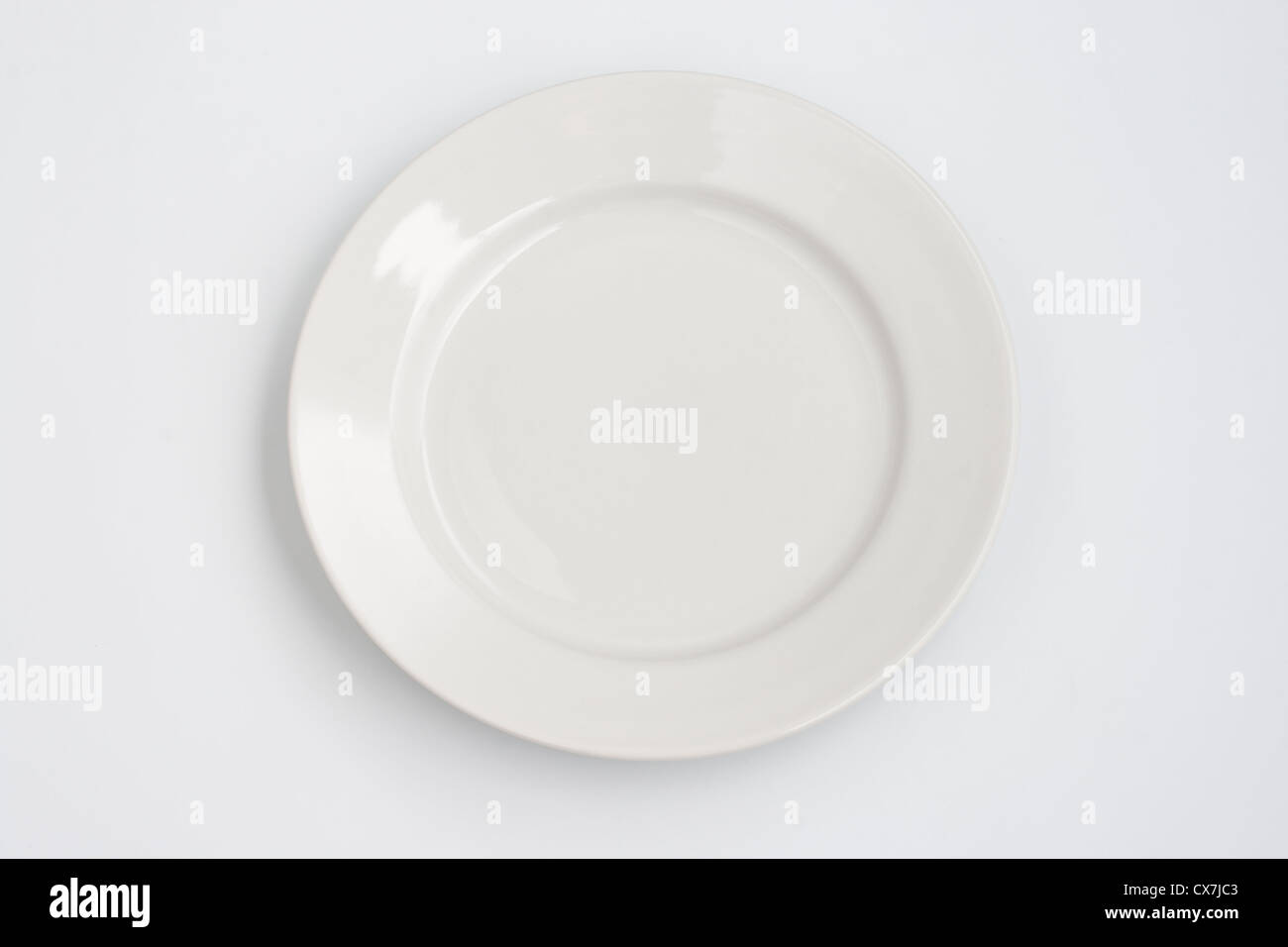 Round plate on white background Stock Photo