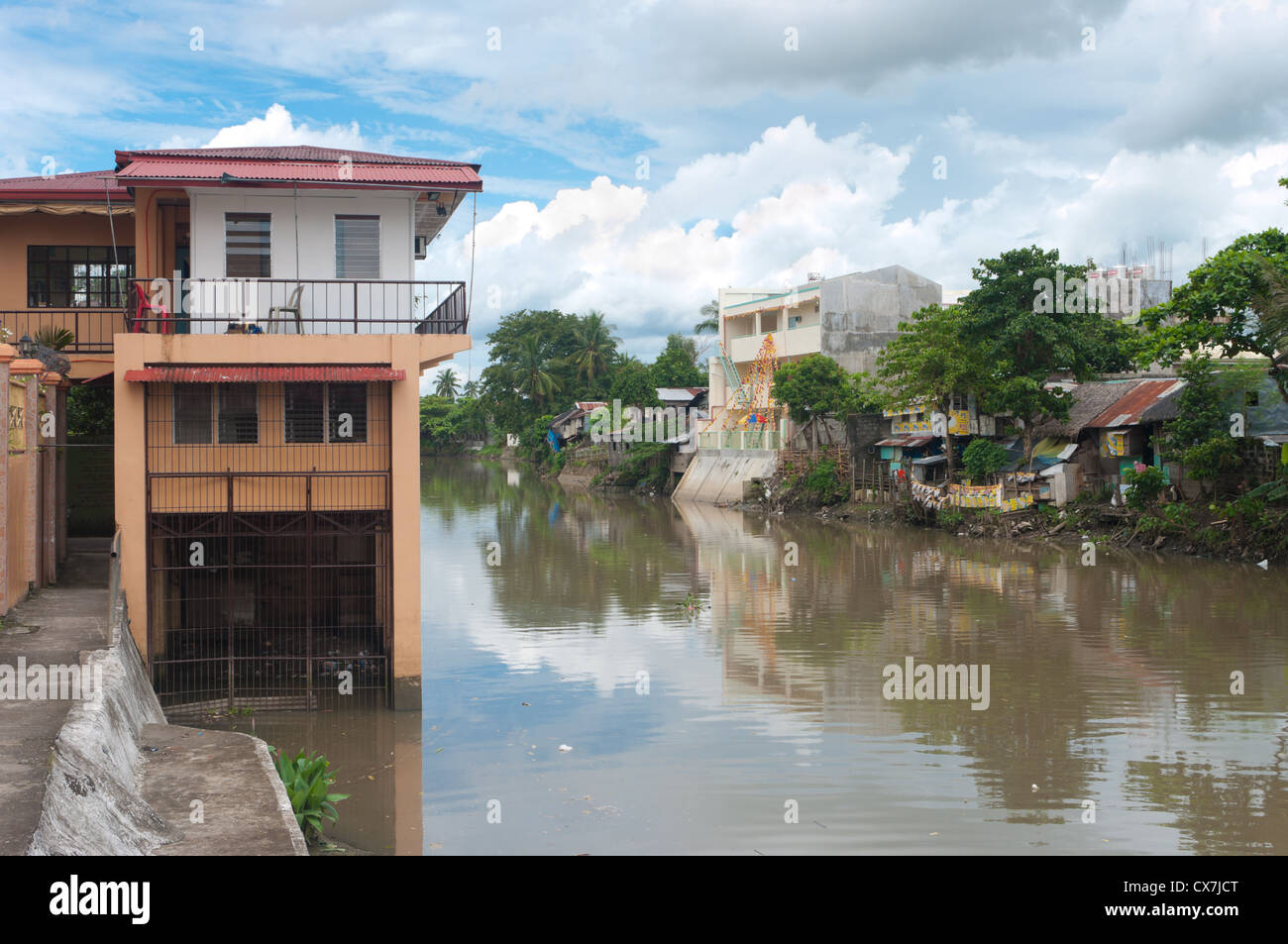 houses along the Naga river in Naga City, Philippines Stock Photo