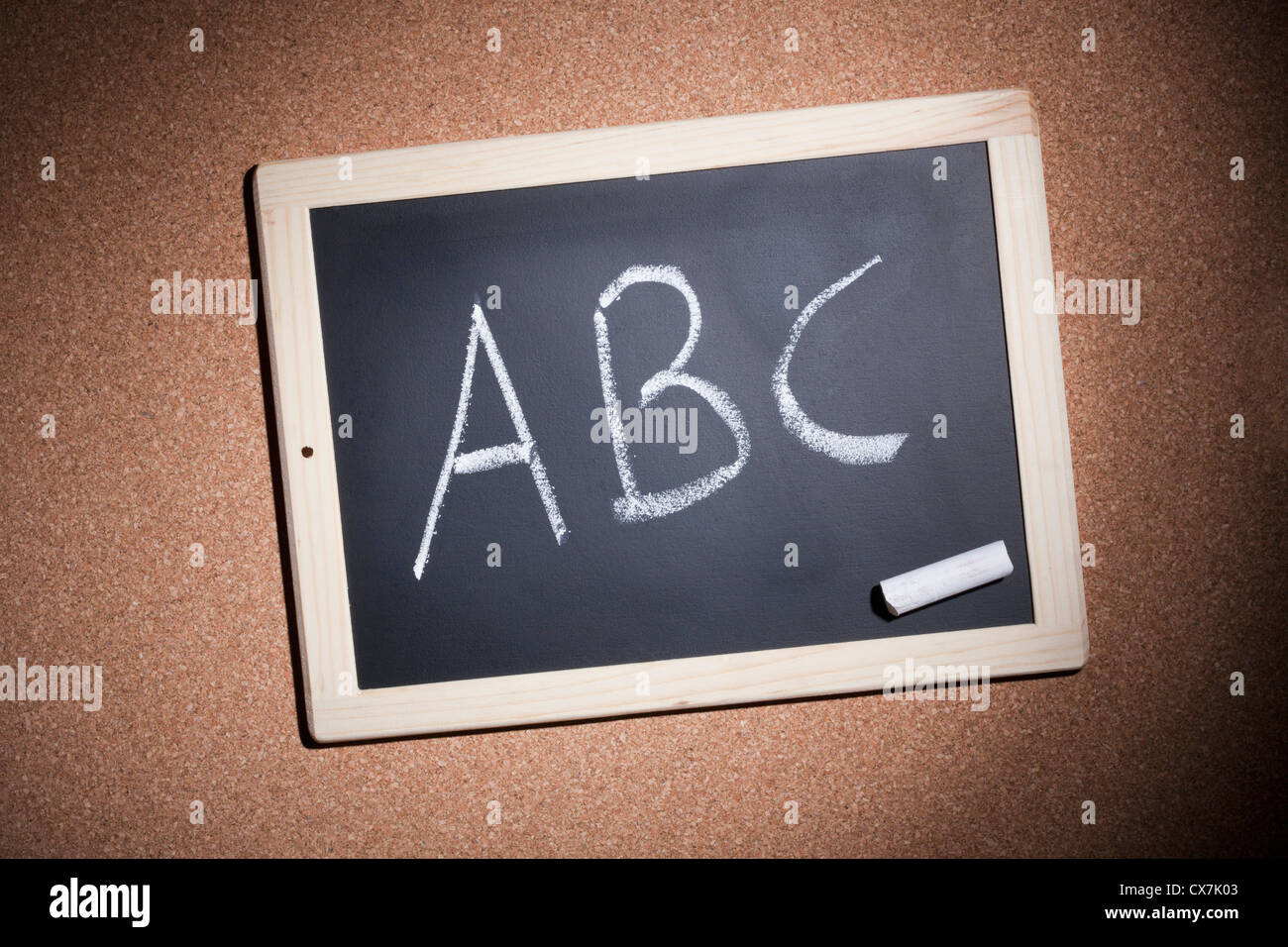 A small chalkboard with the letters, A, B and C handwritten on it Stock Photo