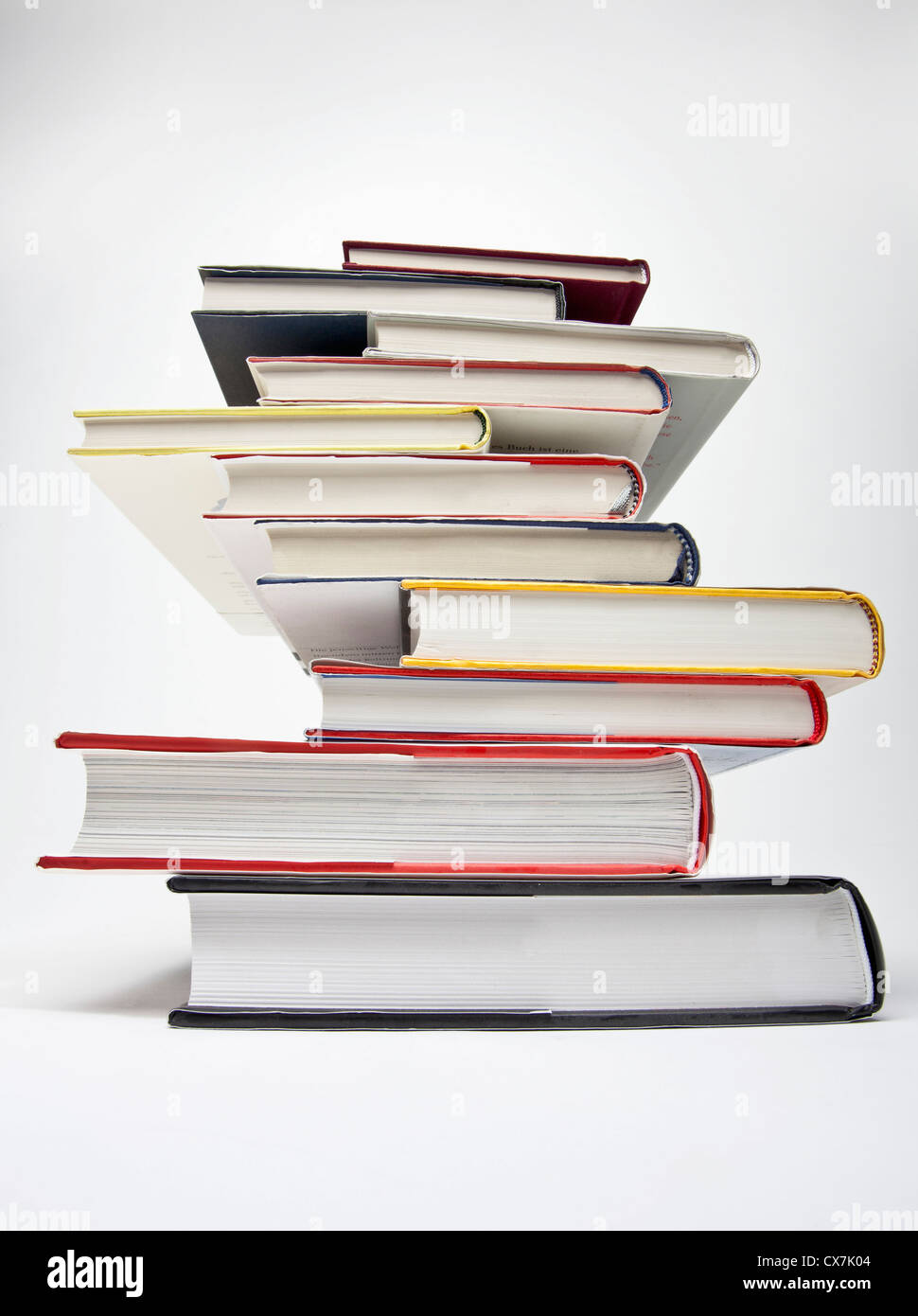 A stack of various hardcover books, diminishing perspective Stock Photo