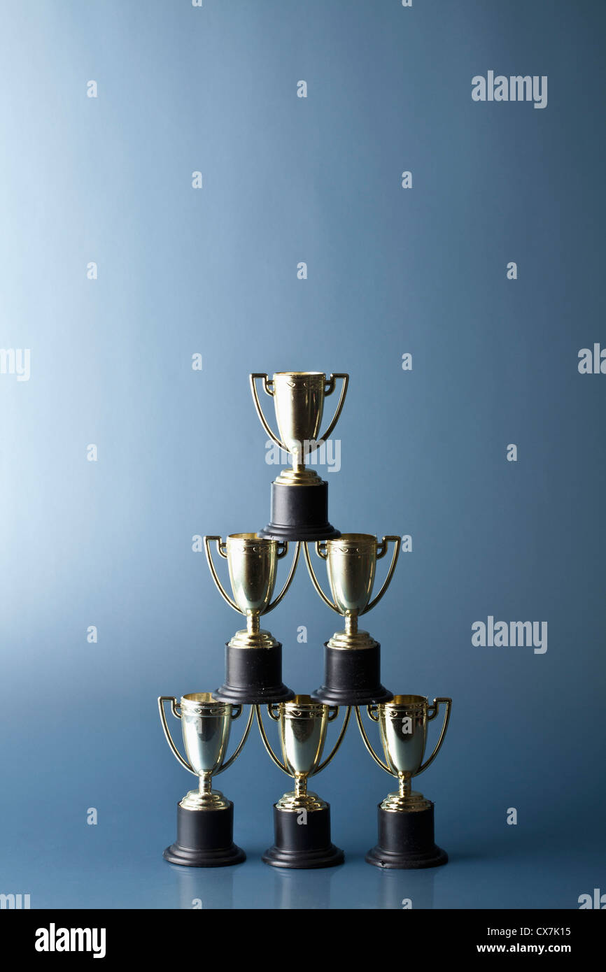 Loving cup trophies stacked in a pyramid Stock Photo