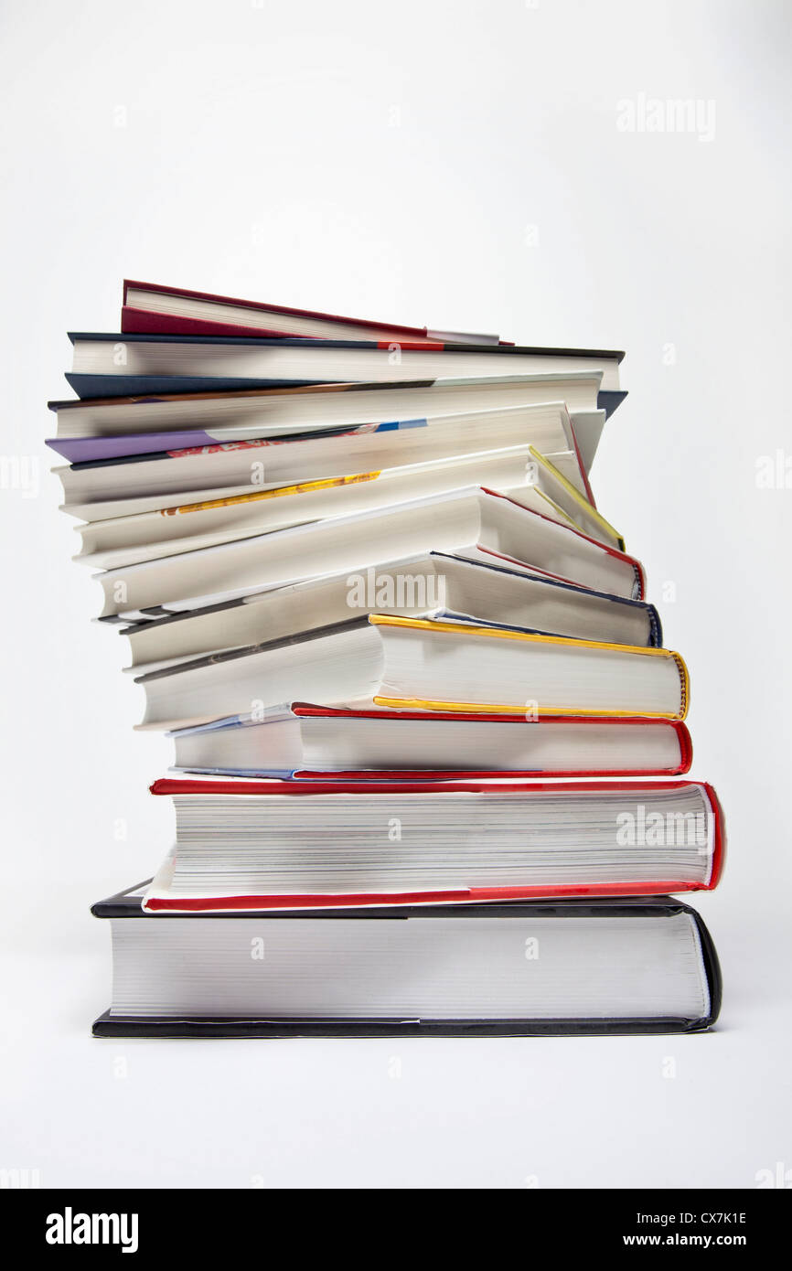 A variety of hardcover books arranged in a spiraling stack Stock Photo ...