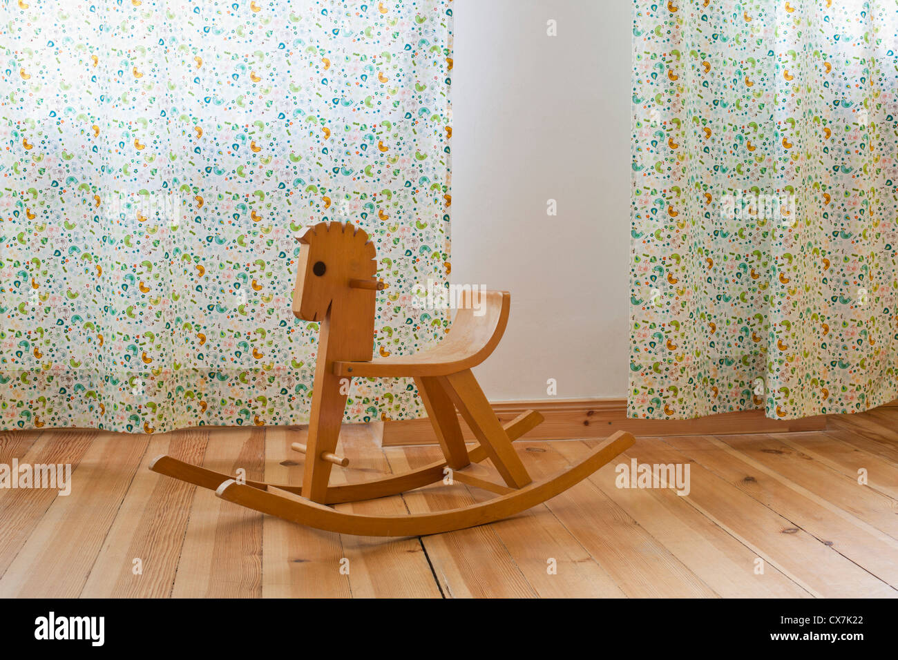 A rocking horse in a domestic room Stock Photo