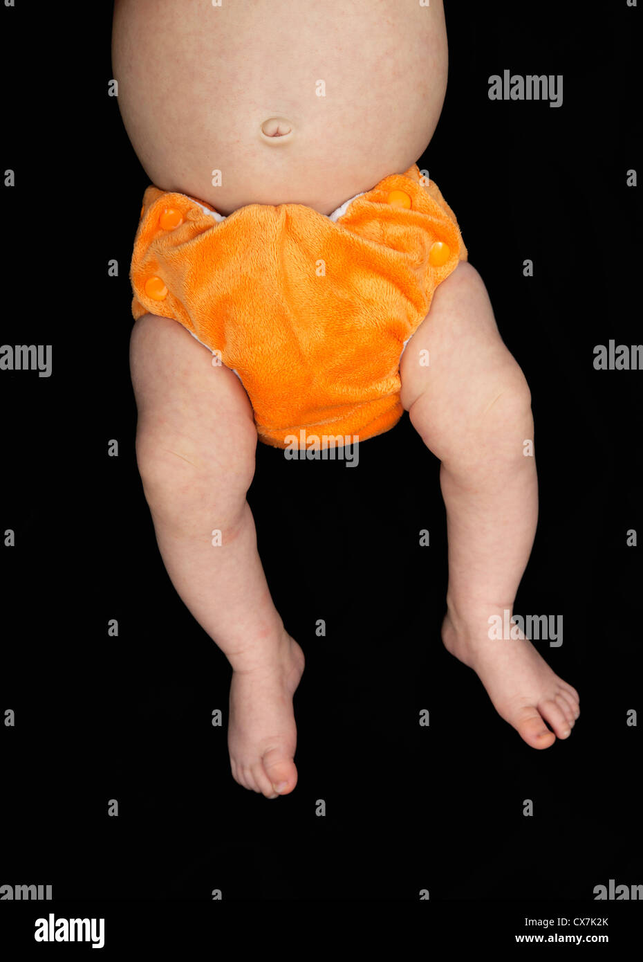 Baby in orange nappy Stock Photo Alamy