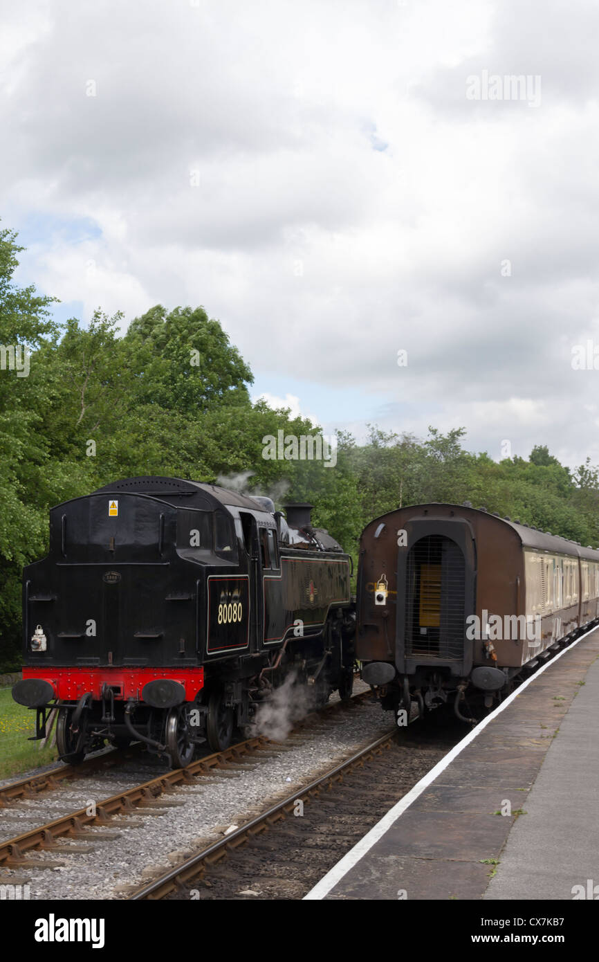 Standard class 4 80080 at ELR Rawtenstall station running round 'The Lancastrian' dining train for the return journey to Bury. Stock Photo