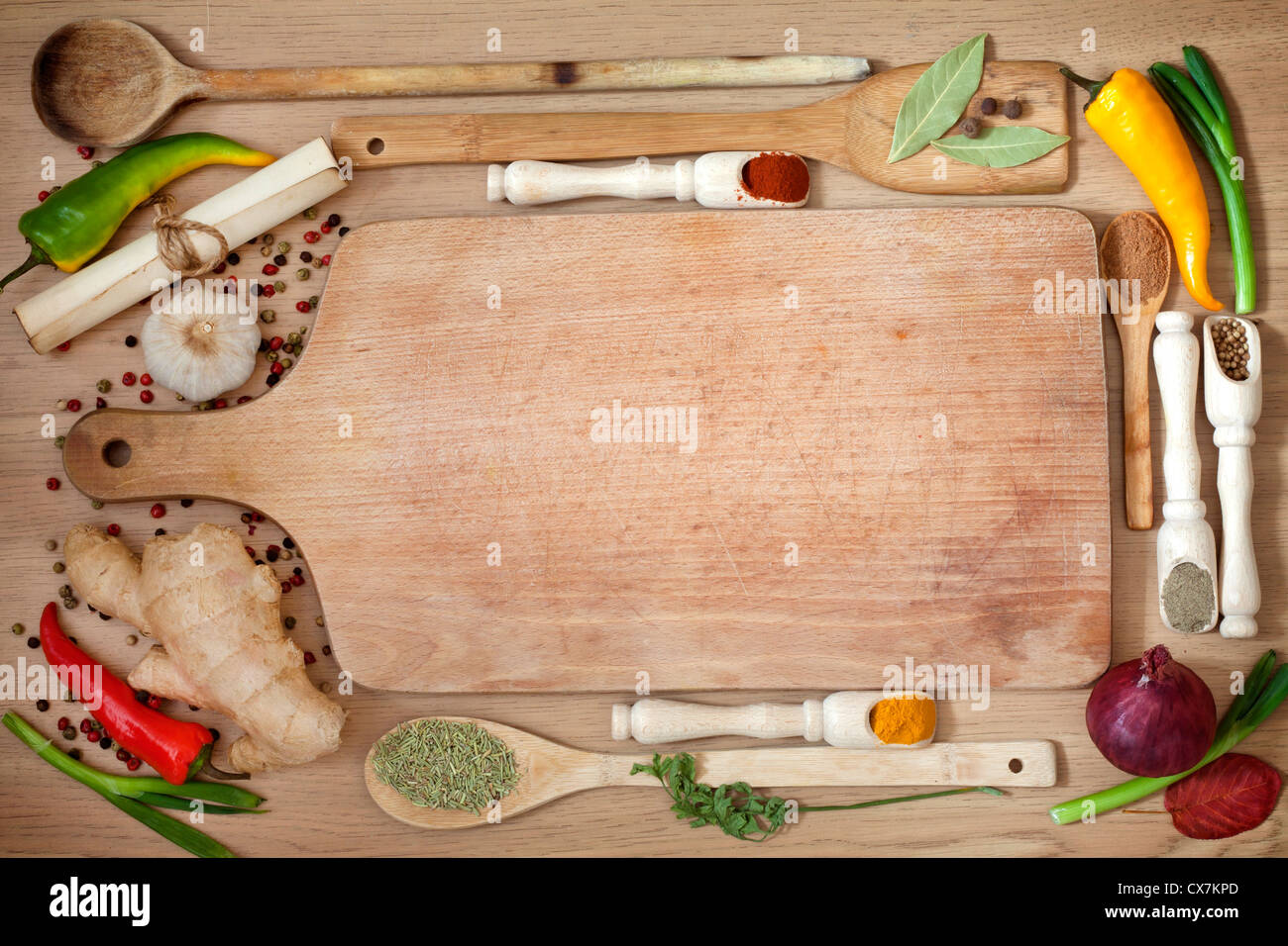 Vegetables and spices border and empty cutting board Stock Photo