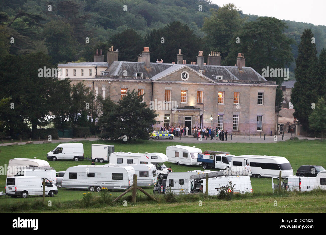 Travelers descend on Stanmer House near Brighton during a wedding. Picture by James Boardman. Stock Photo