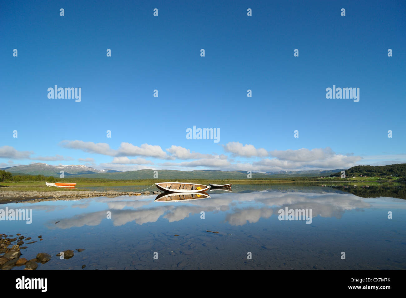 Wooden boats on the mountain lake Stock Photo - Alamy