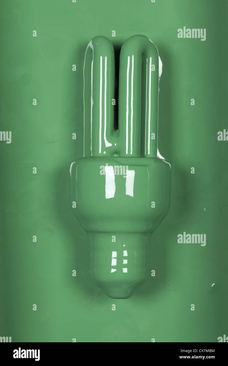 An energy efficient light bulb painted green Stock Photo - Alamy