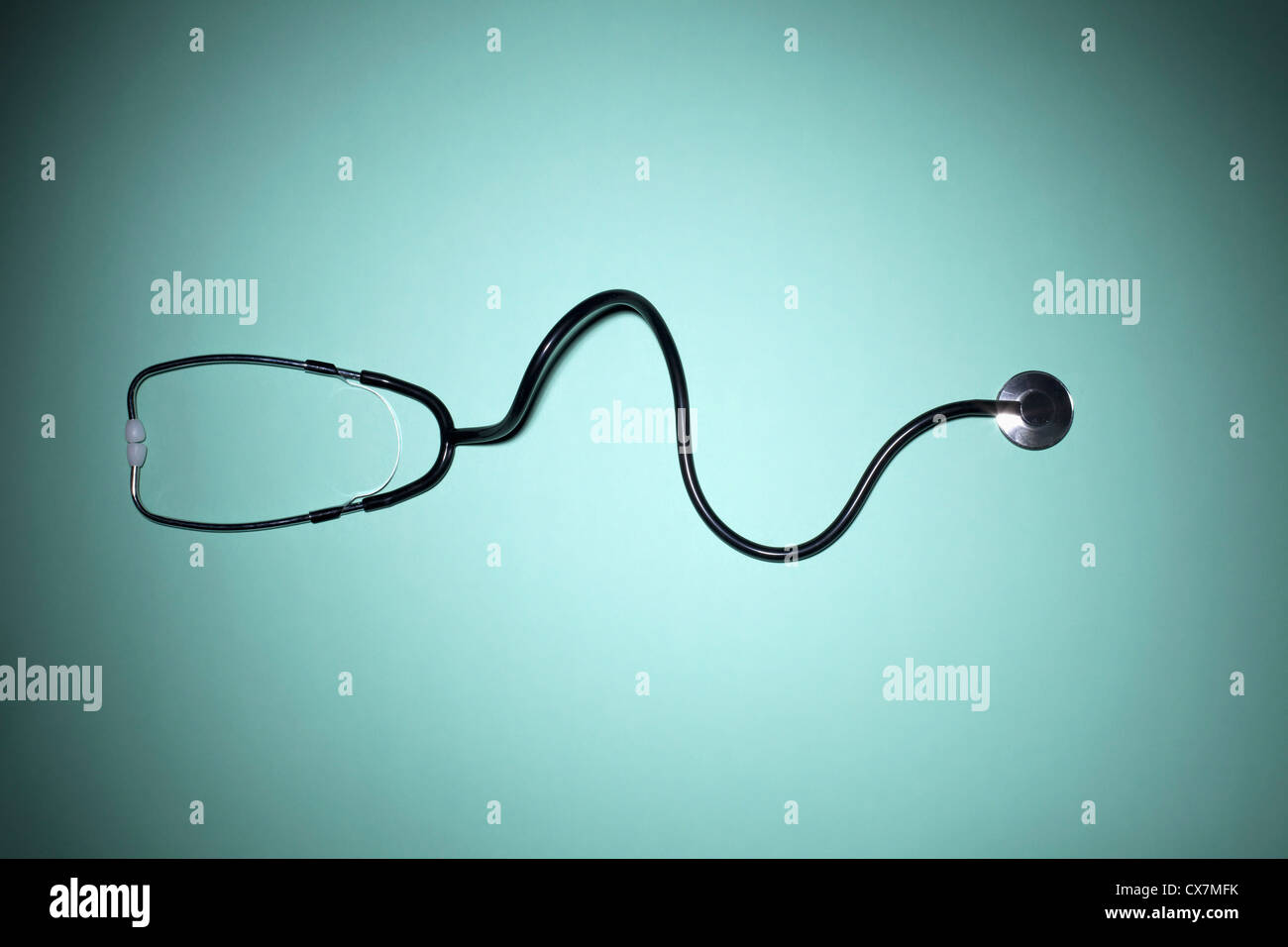A stethoscope on a green background Stock Photo
