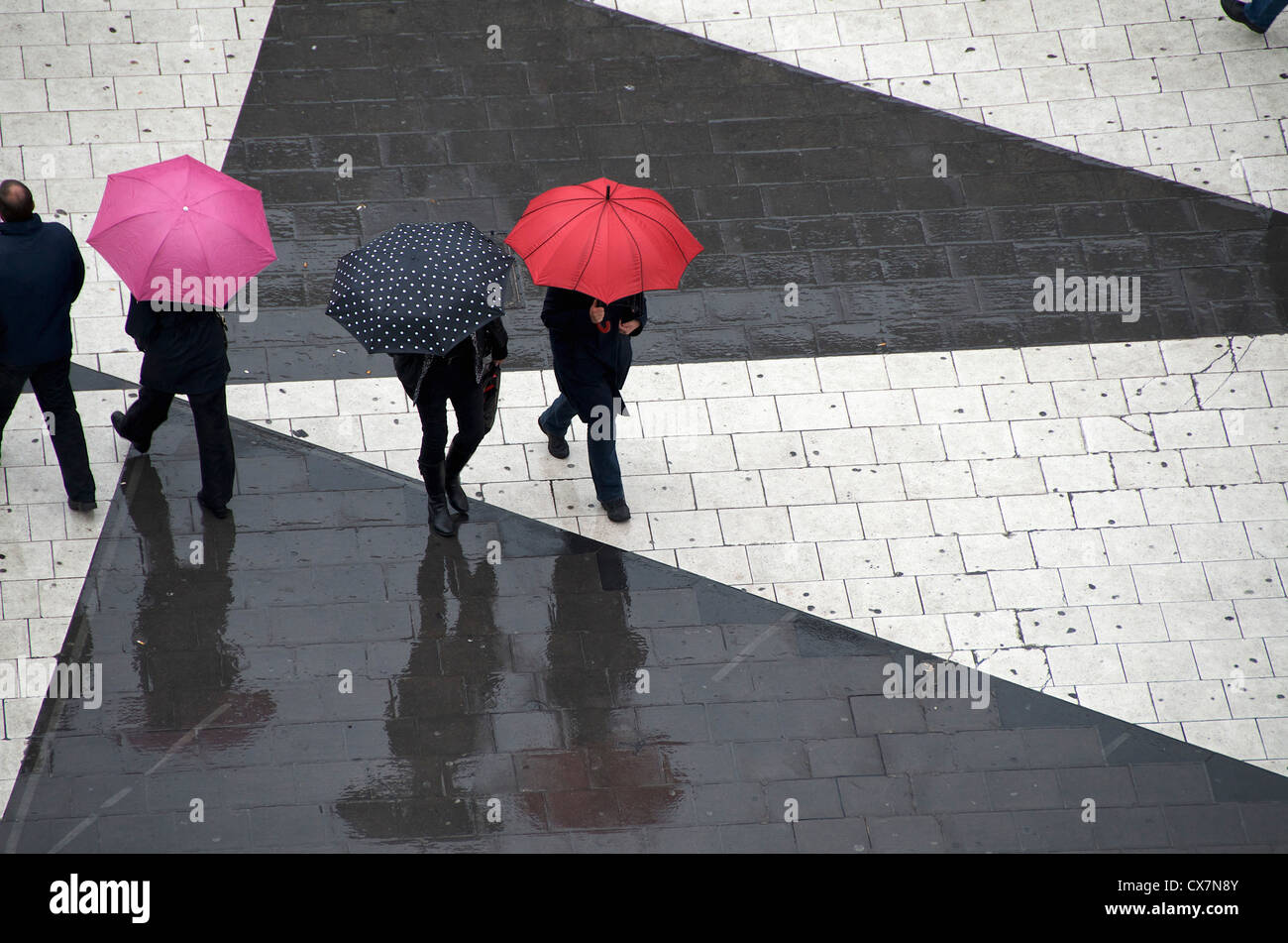 Pedestrians below with umbrellas Stock Photo - Alamy