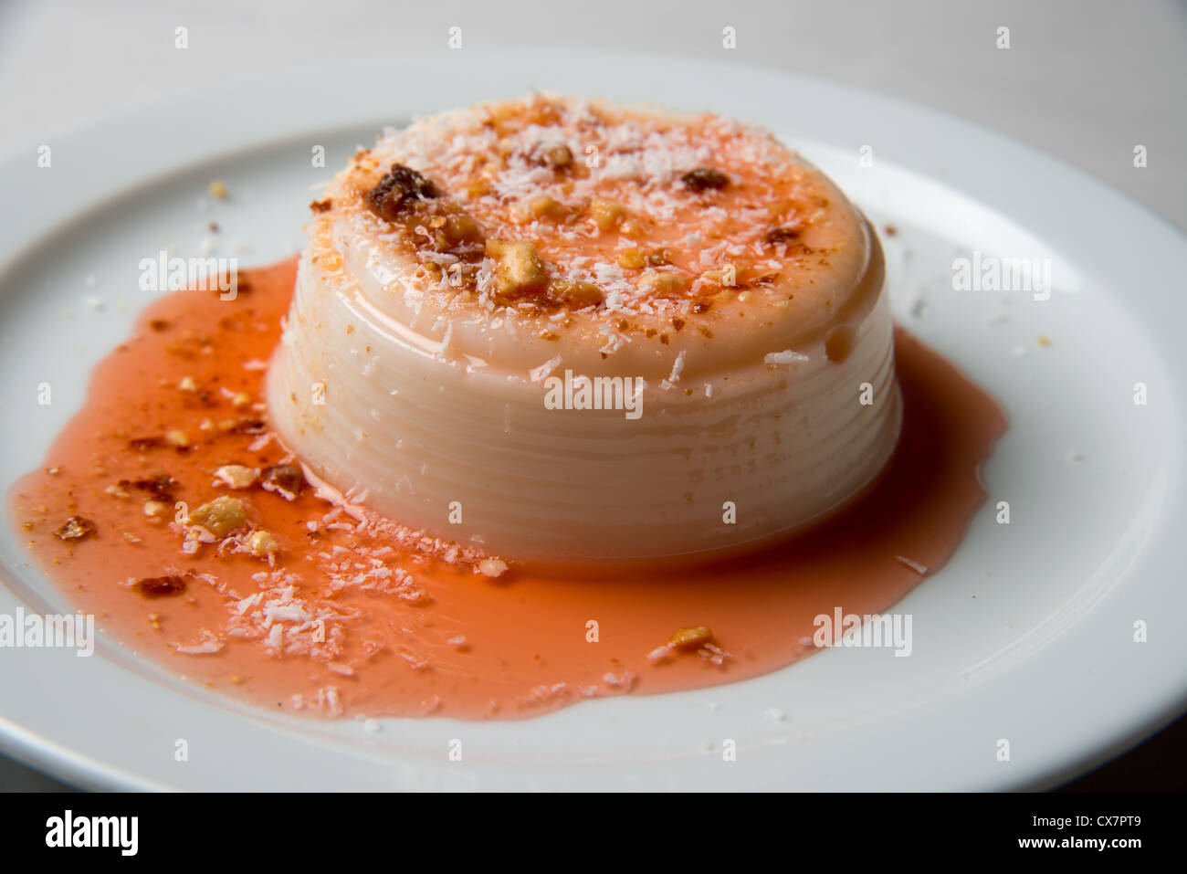 Blancmange (Malabi or Malaby) is a sweet dessert commonly made with milk or cream and sugar Stock Photo