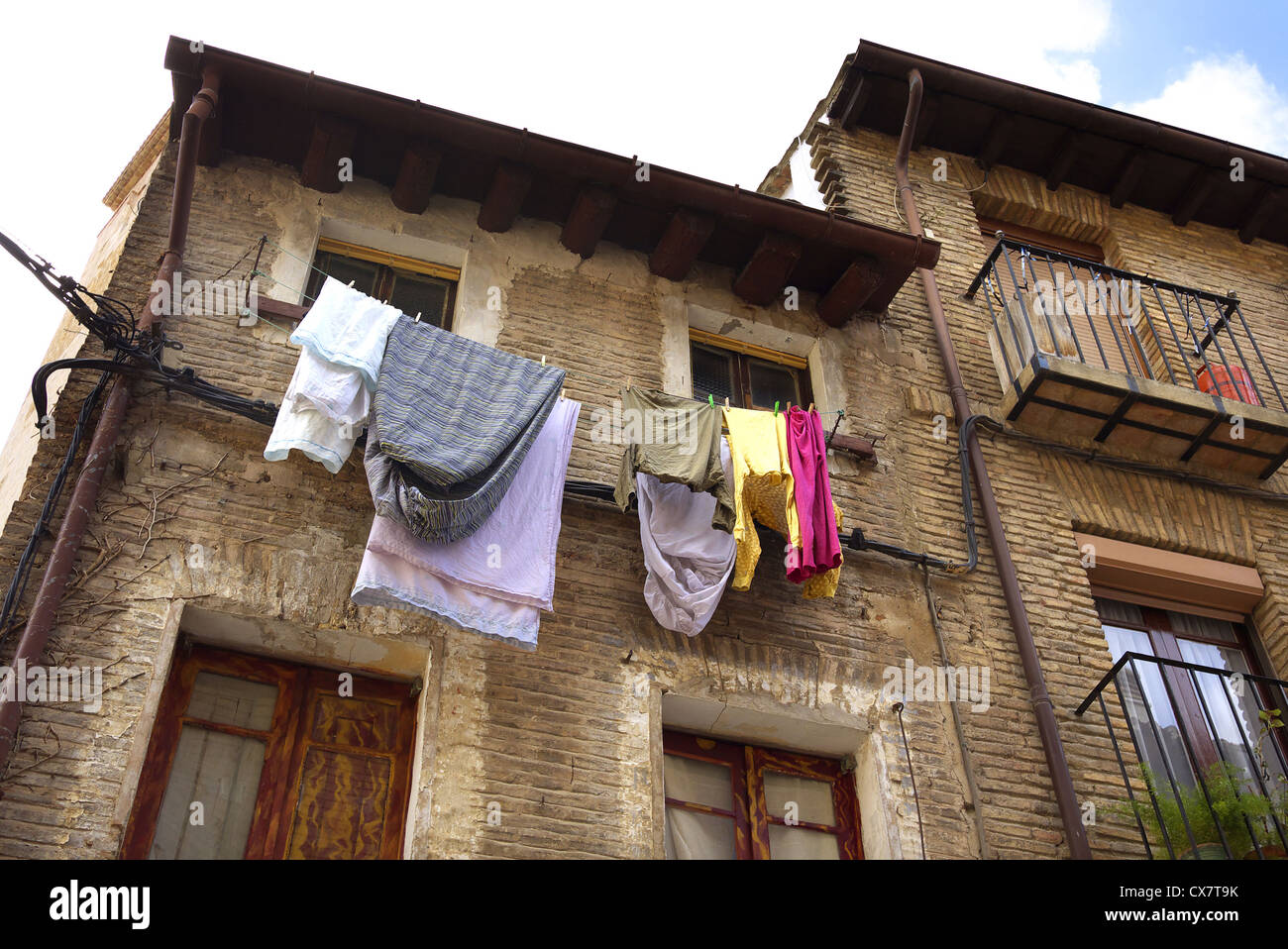 Washing hanging from upstairs windows in Estella, Spain. Stock Photo