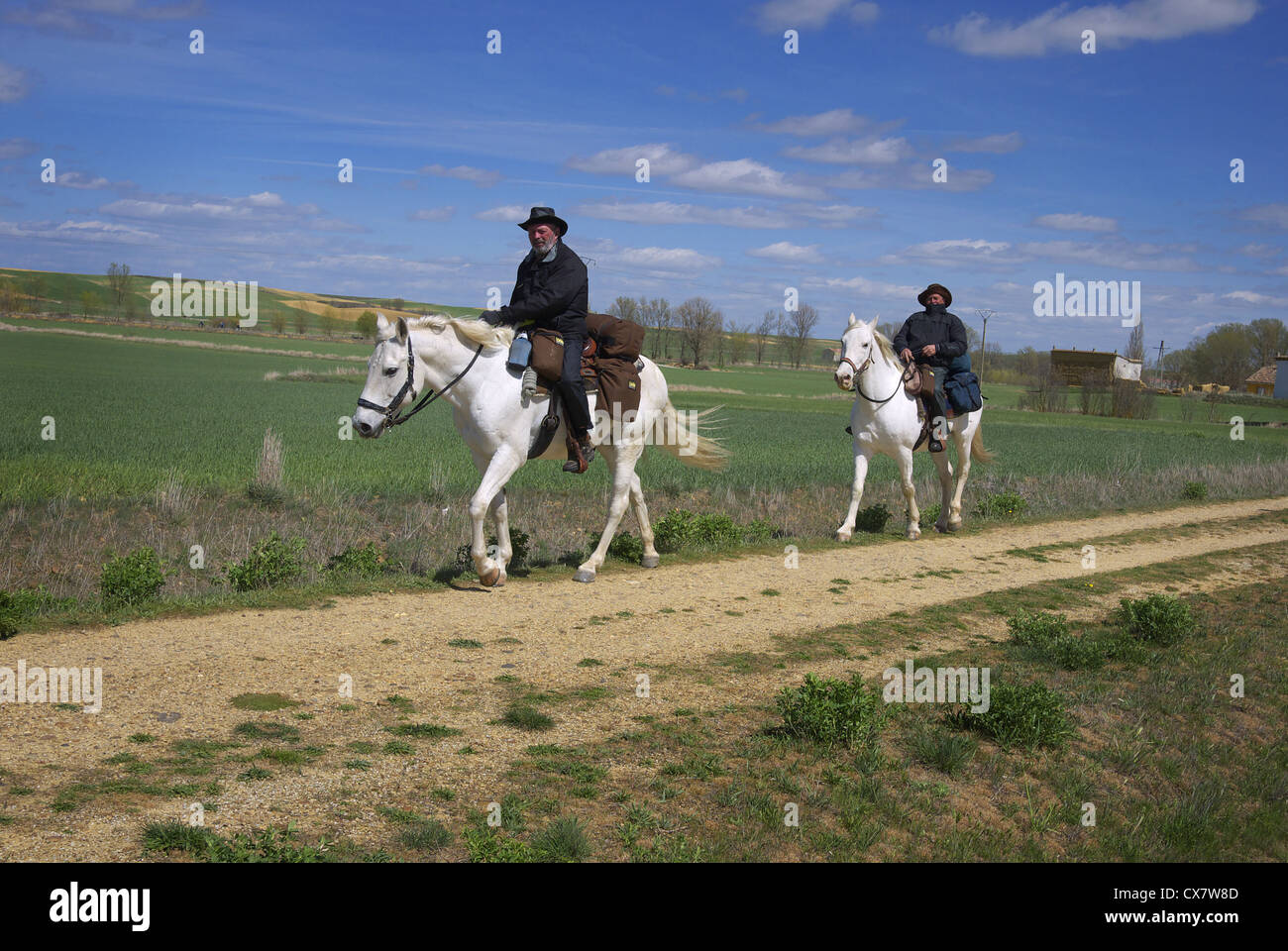 Two pilgrims on horseback en route to Santiago de Compostela, near Fromista, Spain. Stock Photo