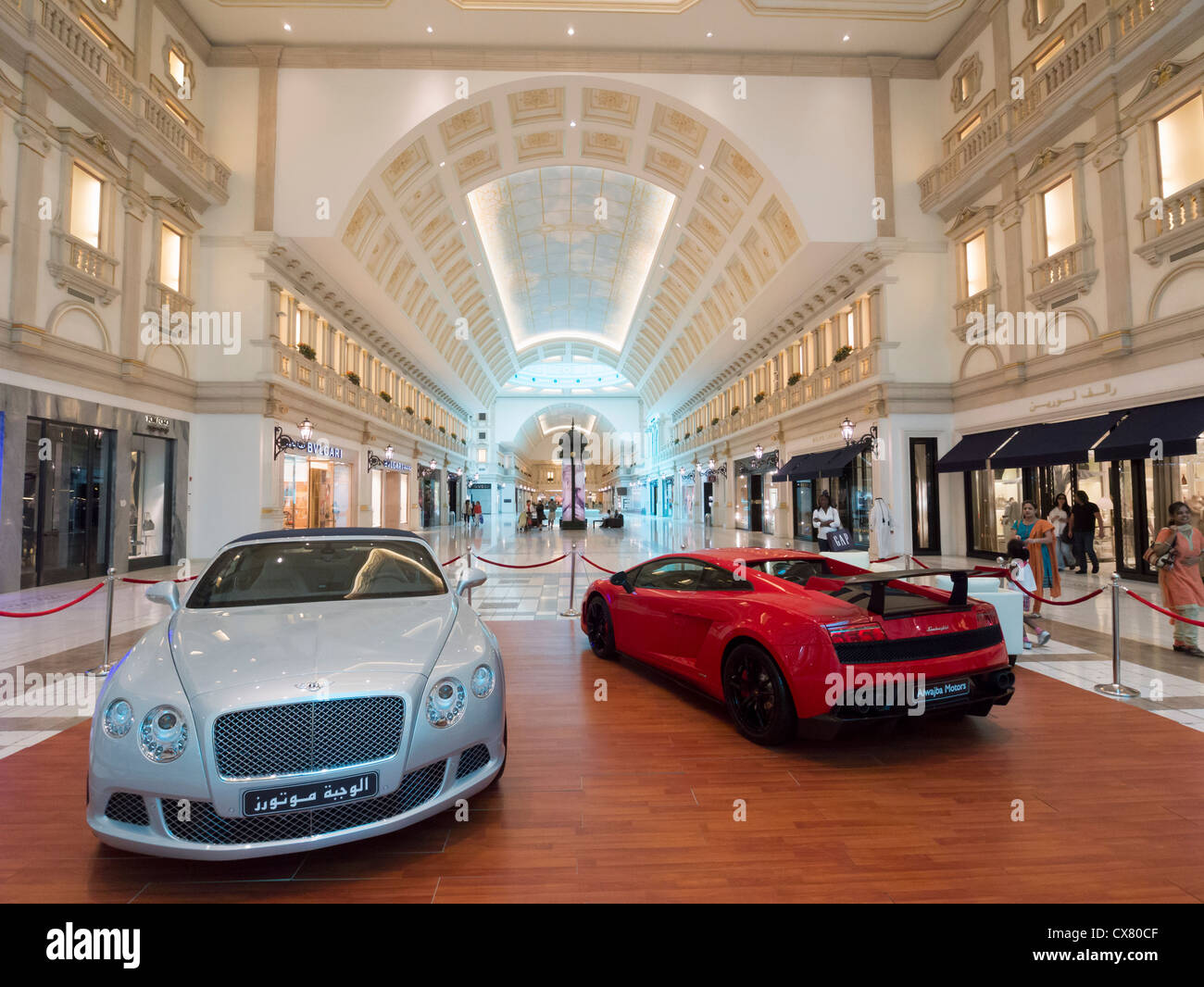 Luxury cars on display at interior of upmarket Villaggio shopping mall in Doha Qatar Stock Photo