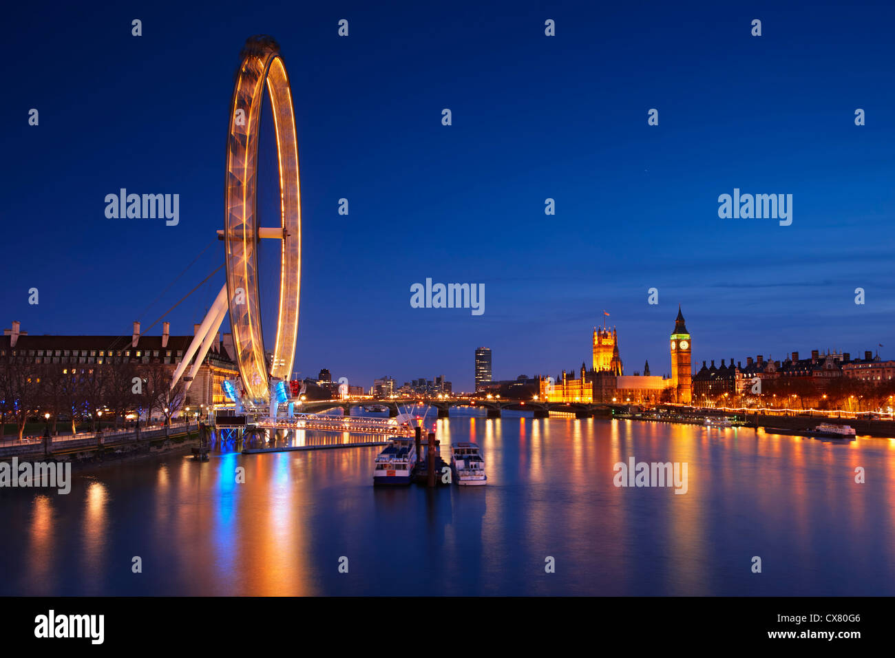 View across the River Thames toward the London Eye and the Houses Of Parliament Stock Photo