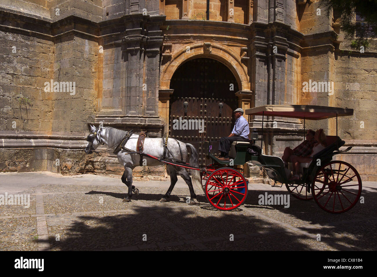 Horse and carriage carrying tourists in Ronda, Andalucia, Spain. Stock Photo