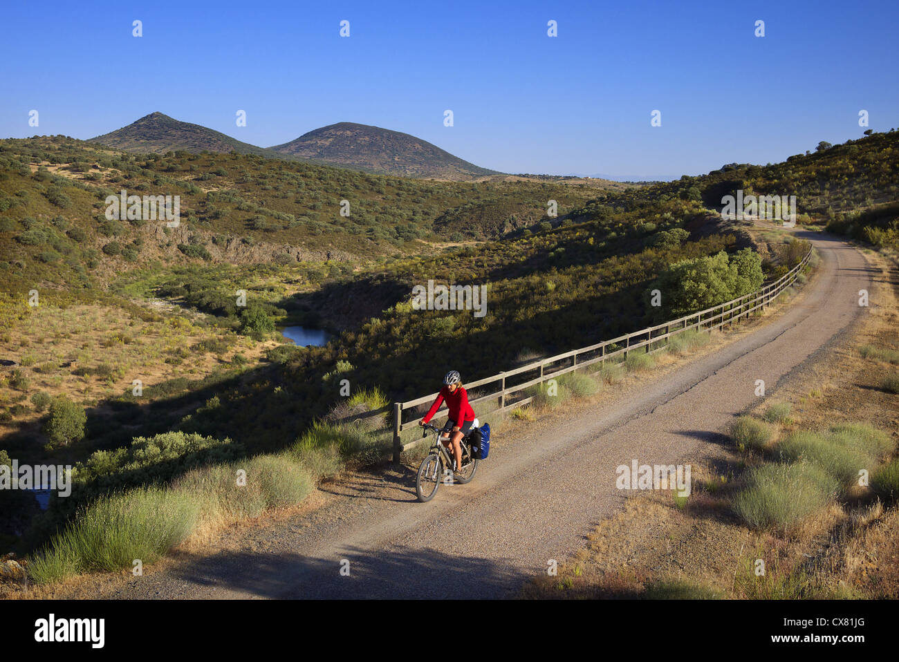 A cyclist on the Via Verde de la Jara in the Castilla-La Mancha region of Spain. Stock Photo