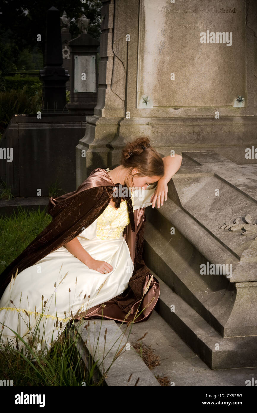 Young victorian woman in mourning in a cemetery Stock Photo - Alamy