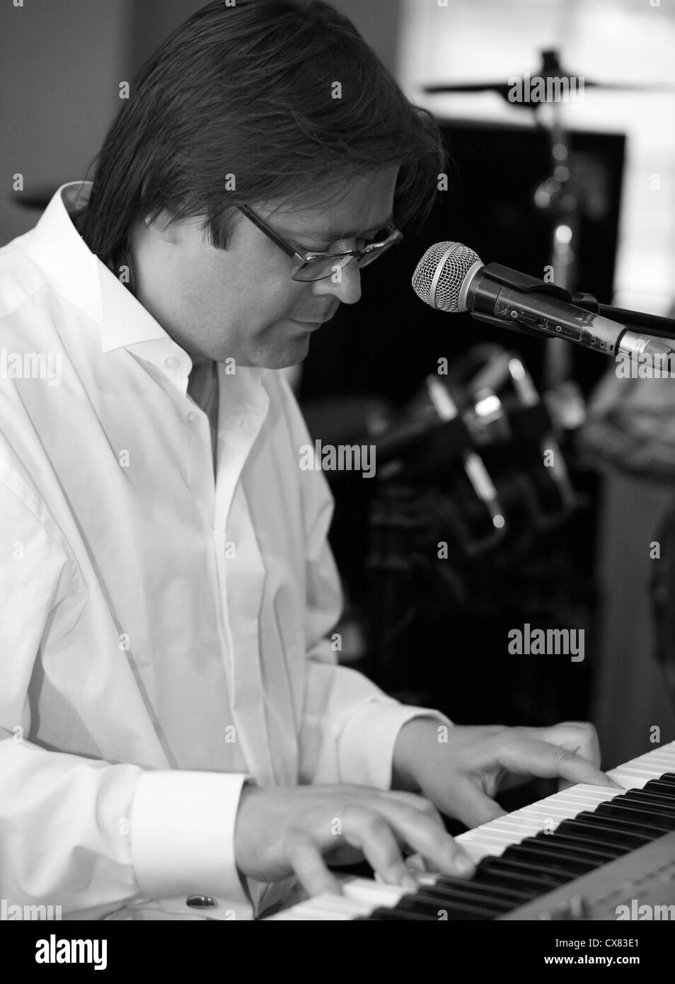 The man plays on an electric piano Stock Photo