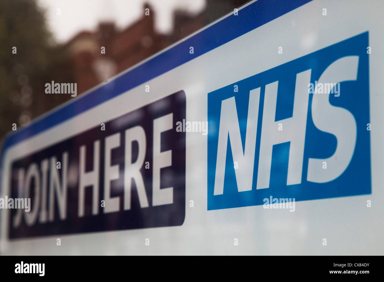 Sign for the NHS National Health Service outside a GP clinic. Stock Photo