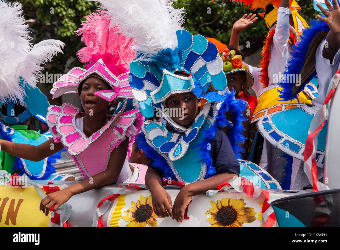 Young Bahamian girls dressed in Junkanoo costumes celebrate graduation ...
