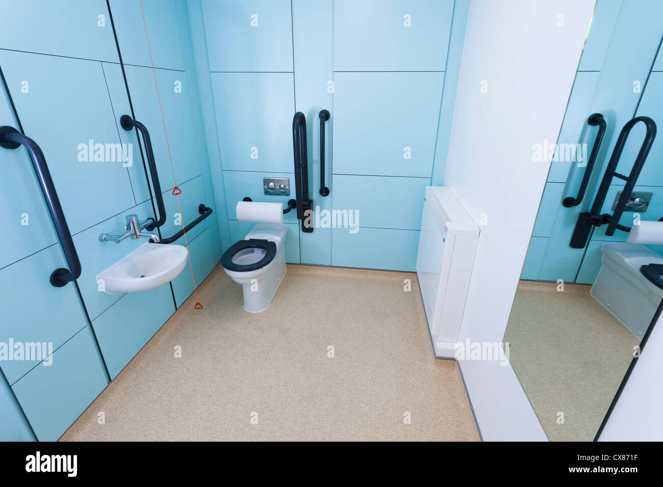 Disabled toilet room with grab rails. Stock Photo